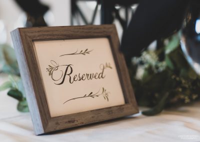 small framed wooden sign saying reserved