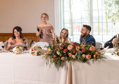 cheerful wedding party at front table