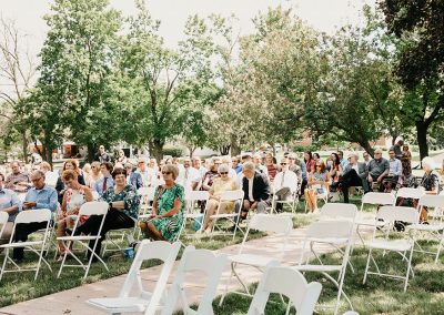 wedding guests seated outdoors